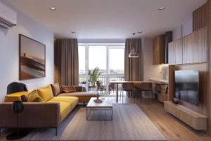 Salon lumineux d'un appartement à acheter à Montpellier avec canapé d'angle jaune et coin cuisine moderne, ouvert sur un balcon aménagé